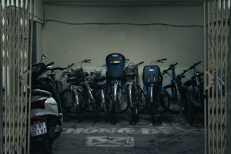 A collection of bicycles parked indoors in Vietnam, highlighting urban transport solutions.